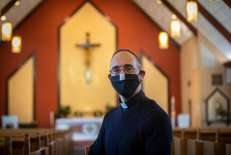 priest wearing mask