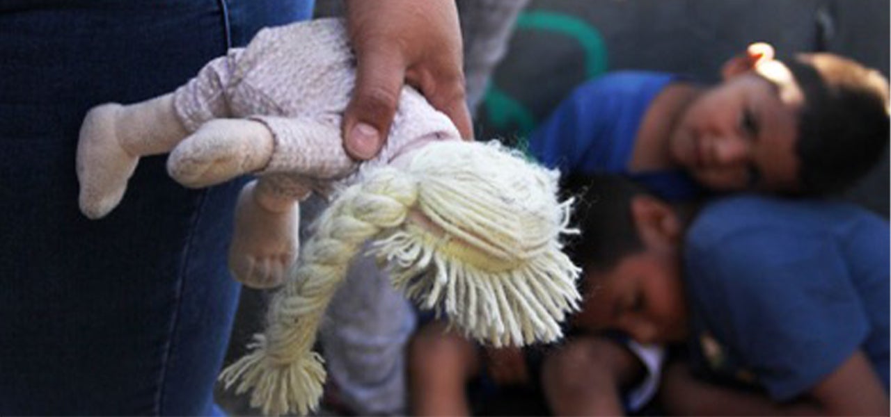 migrant children waiting for reunification.  toy in the foreground