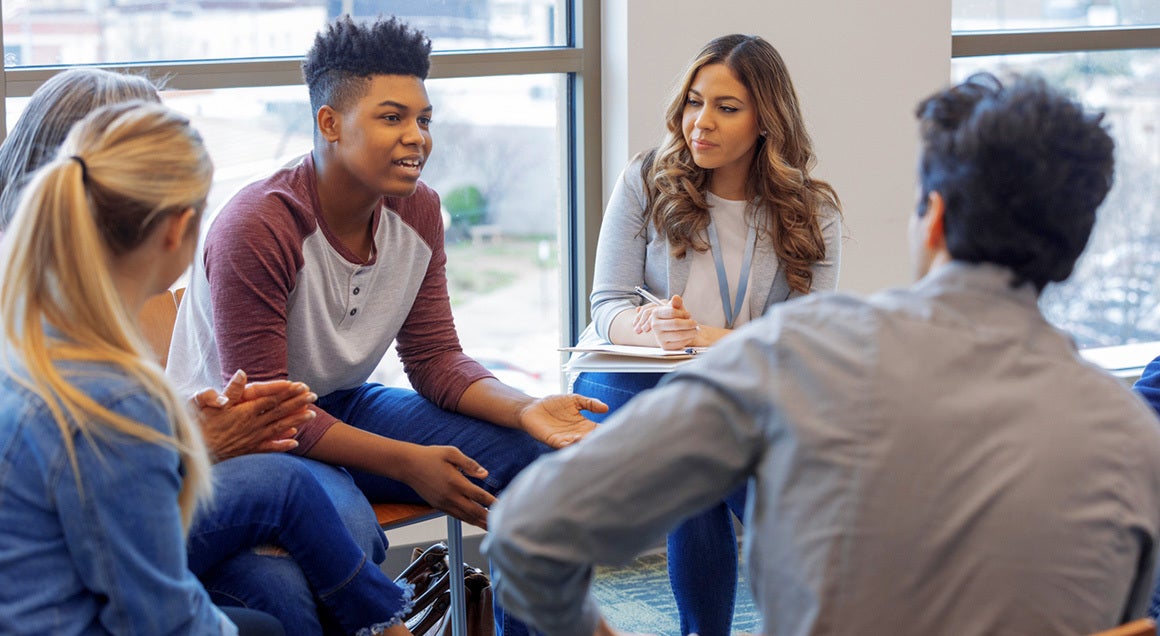 young people talking in a circle