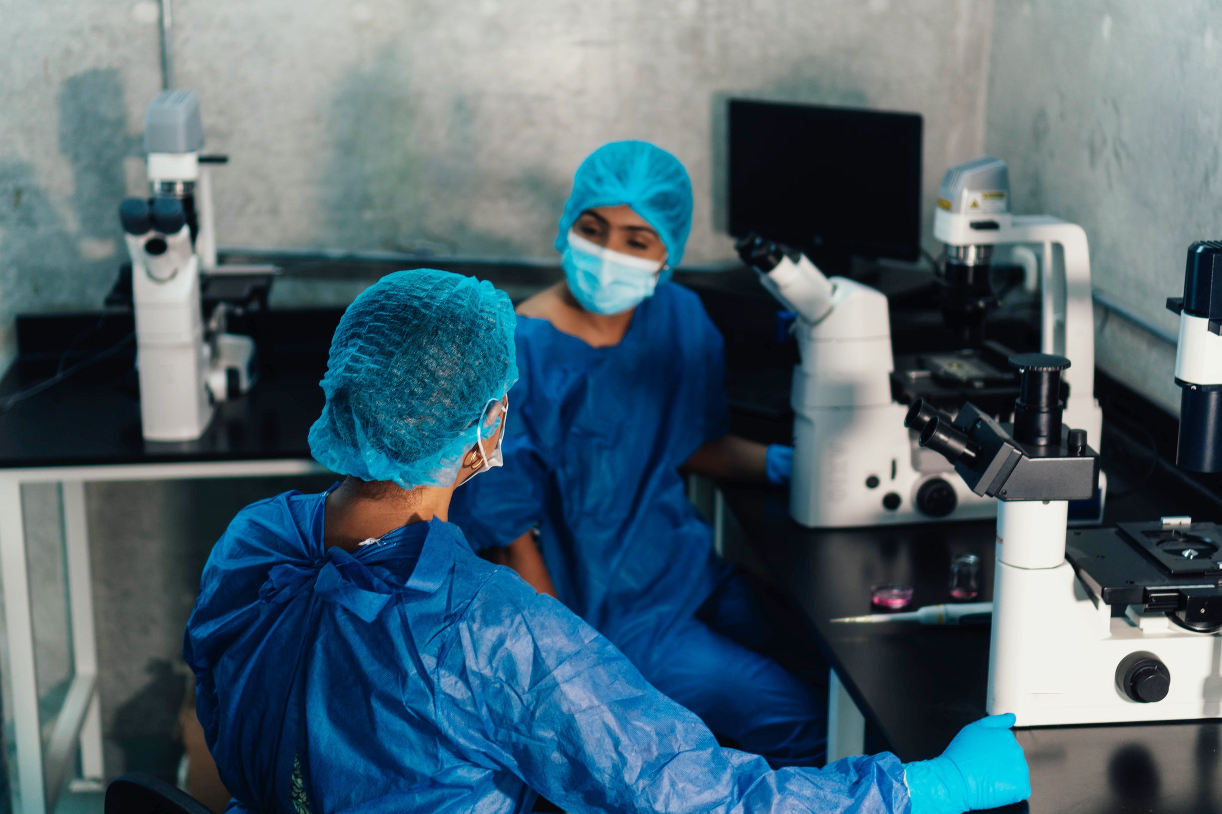 young doctors working with microscopes