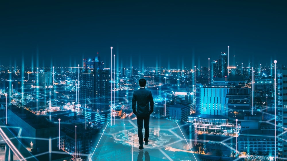 man overlooking a digital landscape