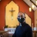 priest wearing mask